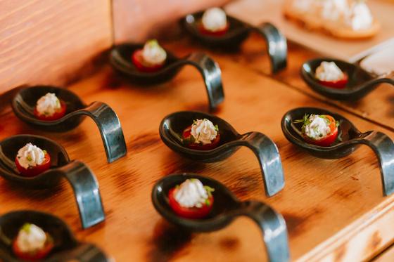Canapes plated on tasting spoons