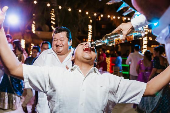 Tequila poured straight from the bottle on the dance floor