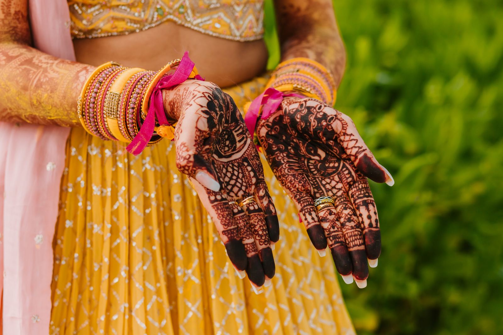Both palms turned up, mehndi finished to the wrist